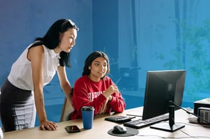 High school student on computer with parent