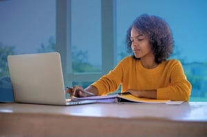 Homeschooled student working independently on coursework. 