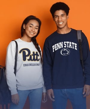 Two students - one from University of Pittsburgh (Engineering) and one from Penn State - smiling and happy