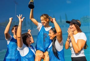 A group of young college athletes celebrating a victory, representing the main topic of the webinar